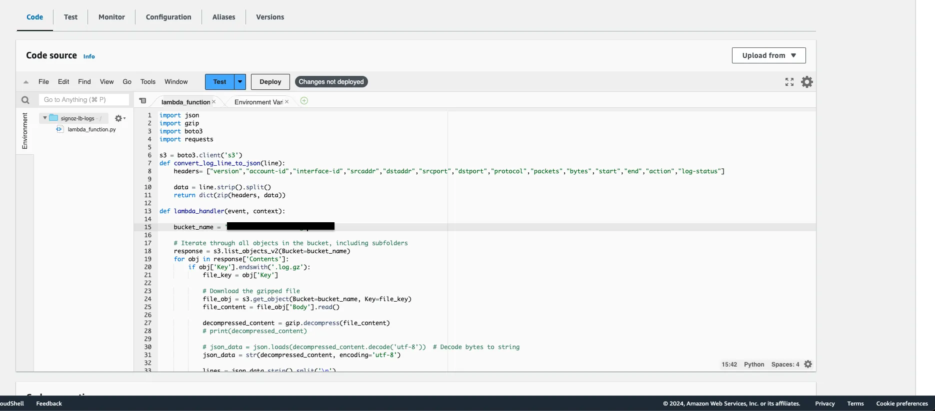 Lambda function code editor showing the VPC log forwarding code